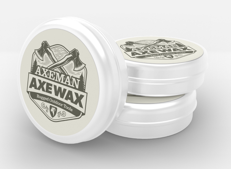 Canadian-made Axeman Axe Wax tin beside an axe and folding saw, tool care products for protecting axes and saws from moisture and rust