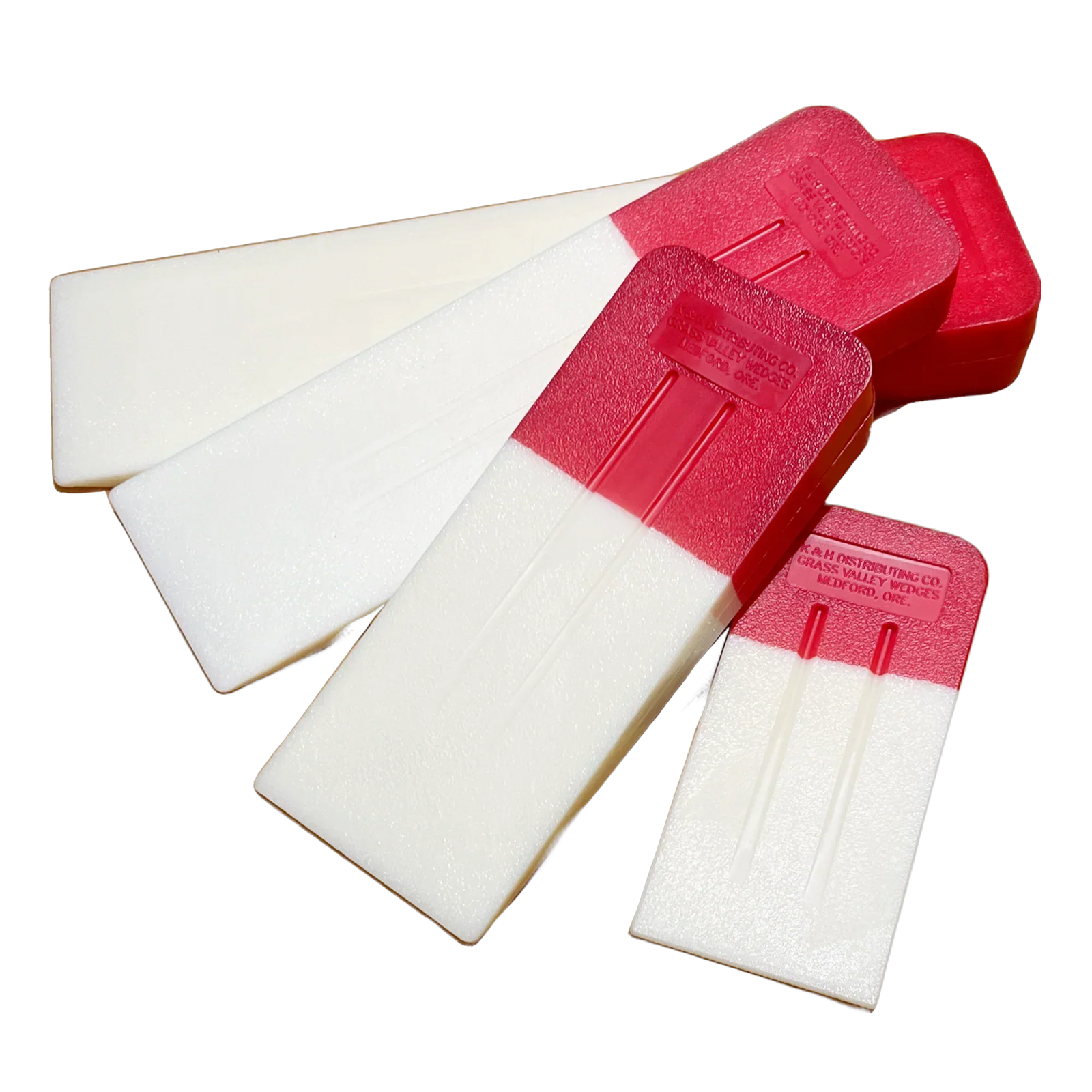 Assortment of K&H Famous Red Head felling wedges – durable high-impact plastic tree felling tools.